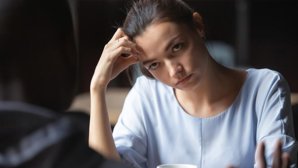 Bored,Unhappy,Girlfriend,Listening,To,African,American,Boyfriend,In,Cafe,