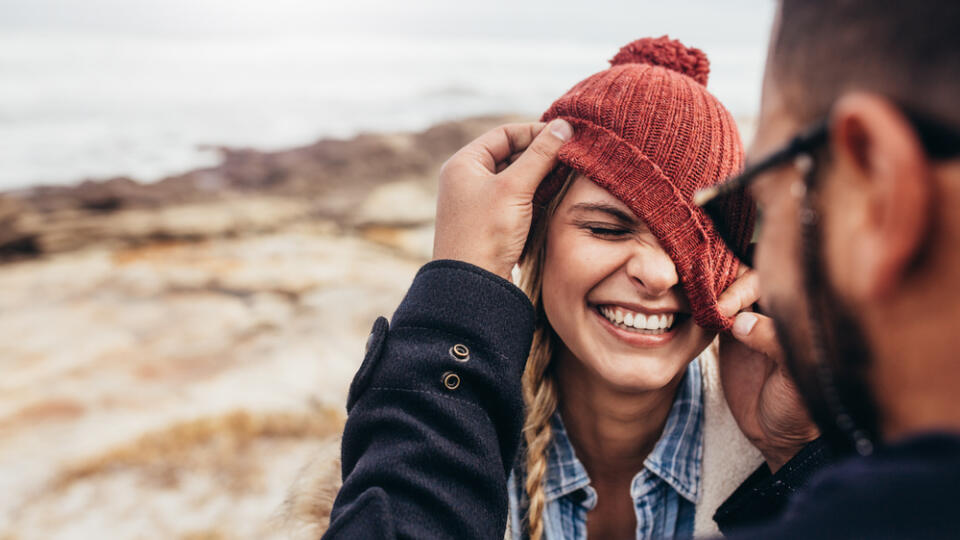 Close,Up,Portrait,Of,Smiling,Young,Couple,Having,Fun,Outdoors.