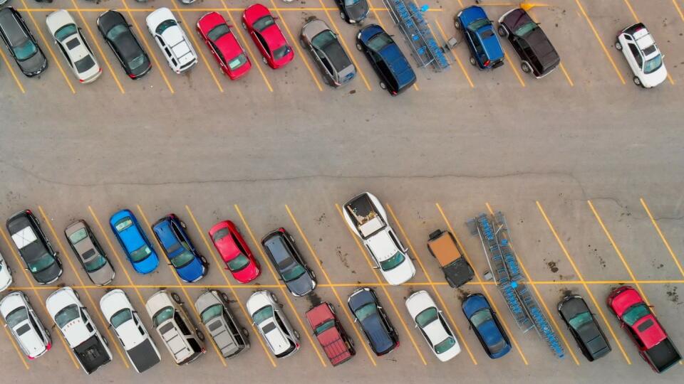 Aerial view of cars at large outdoor parking lots; USA