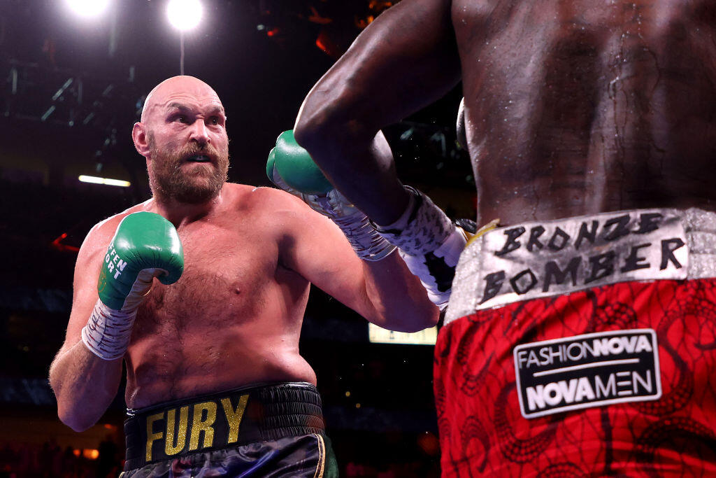 LAS VEGAS, NEVADA - OCTOBER 09: Tyson Fury (L) puts his fists up during his WBC heavyweight title fight against Deontay Wilder at T-Mobile Arena on October 09, 2021 in Las Vegas, Nevada. (Photo by Al Bello/Getty Images)