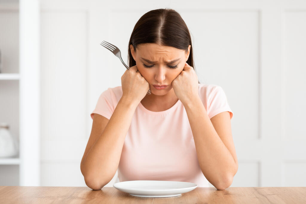 Dieting,Concept.,Unhappy,Woman,Looking,At,Empty,Plate,Losing,Weight