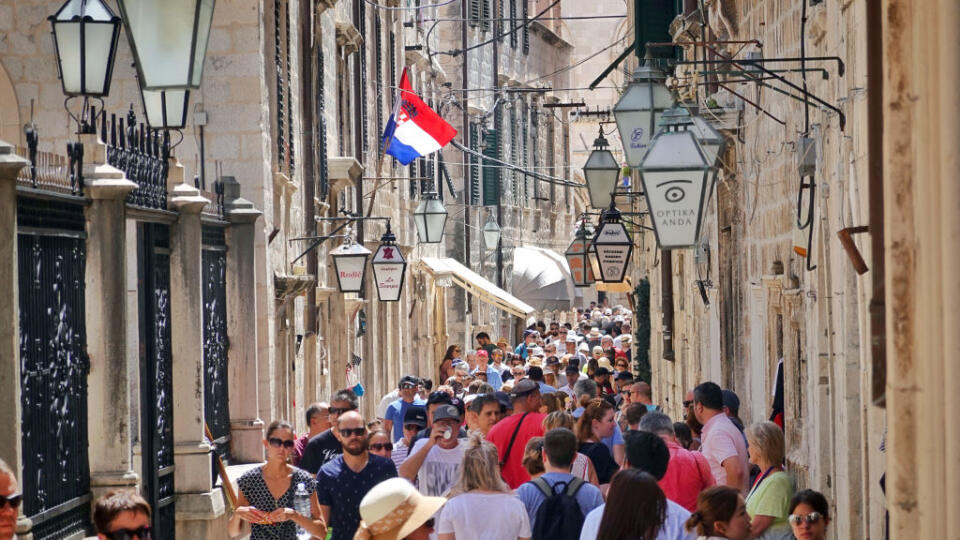 15 June 2019, Croatia, Dubrovnik: Tourists walk inside the fortress wall through the old town on the Ulica Puca. The approximately two kilometre long wall is between three and six metres wide along its entire length and is one of the city's landmarks. Photo: Soeren Stache/dpa-Zentralbild/ZB (Photo by Soeren Stache/picture alliance via Getty Images)