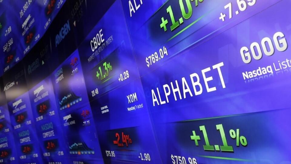 Electronic screens post prices of Alphabet stock, Monday, Feb. 1, 2016, at the Nasdaq MarketSite in New York. Alphabet, the parent company of Google, reports quarterly earnings Monday. (AP Photo/Mark Lennihan)