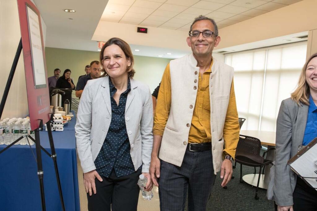 CAMBRIDGE, MA - OCTOBER 14: Esther Duflo, left, and Abhijit Banerjee, who share a 2019 Nobel Prize in Economics with Michael Kremer, arrive for their press conference at Massachusetts Institute of Technology on October 14, 2019 in Cambridge, Massachusetts. (Photo by Scott Eisen/Getty Images)