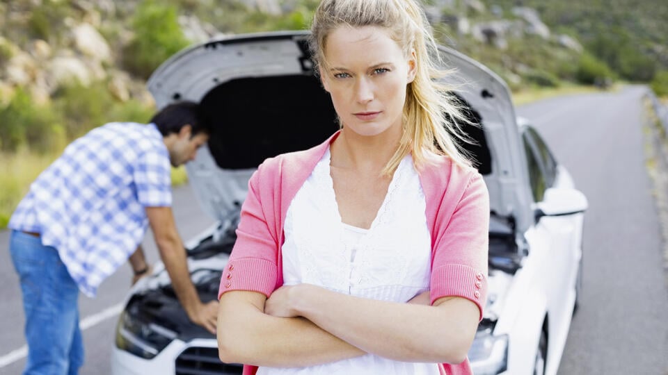 Couple after a car breakdown at the side of the road