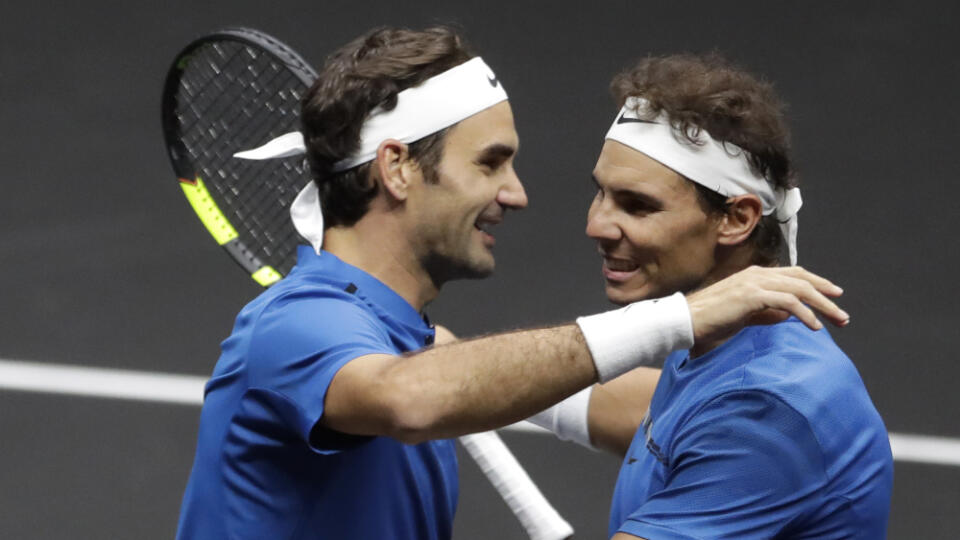 Europe's Roger Federer, left, and Rafael Nadal, right, celebrate after defeating World's Jack Sock and Sam Querrey in their Laver Cup doubles tennis match against in Prague, Czech Republic, Saturday, Sept. 23, 2017. (AP Photo/Petr David Josek)
