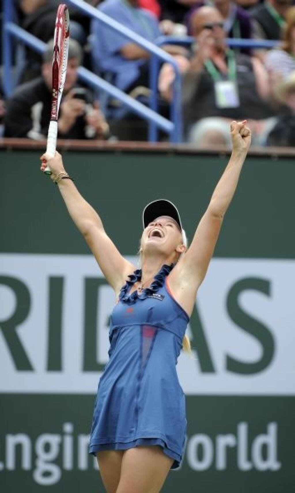 Caroline Wozniacki, of Denmark, reacts after defeating Marion Bartoli, of France, in the women's final at the BNP Paribas Open tennis tournament, Sunday, March 20, 2011, in Indian Wells, Calif. Wozniacki won 6-1, 2-6, 6-3. (AP Photo/Mark J. Terrill)