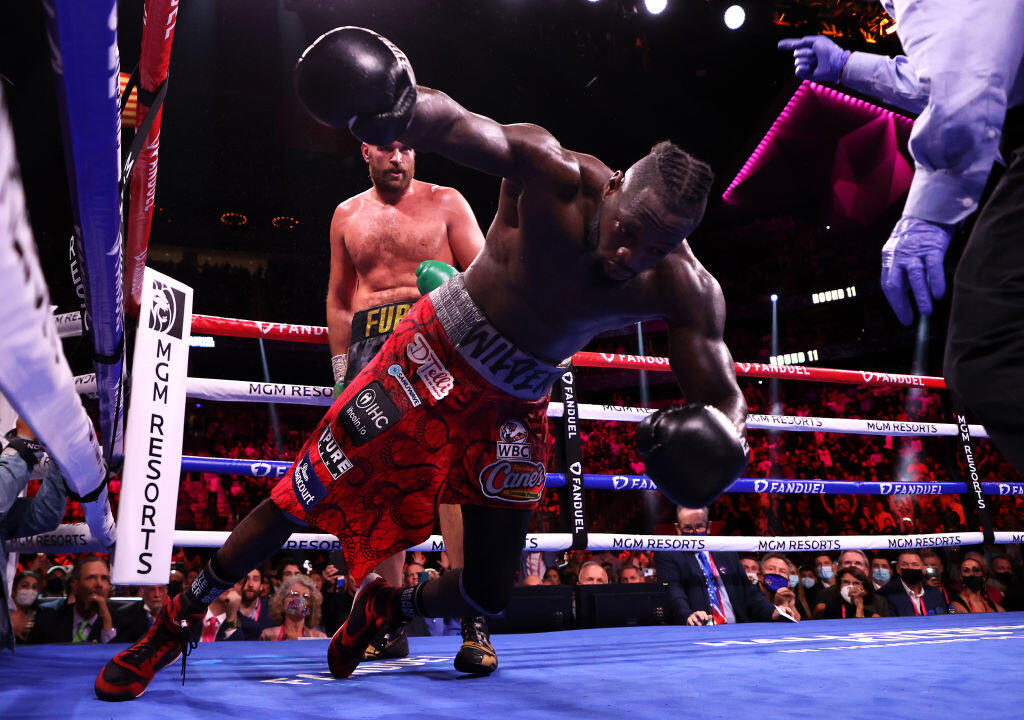 LAS VEGAS, NEVADA - OCTOBER 09: Deontay Wilder (R) is knocked out by Tyson Fury in the 11th round during their WBC heavyweight title fight at T-Mobile Arena on October 09, 2021 in Las Vegas, Nevada. (Photo by Al Bello/Getty Images)