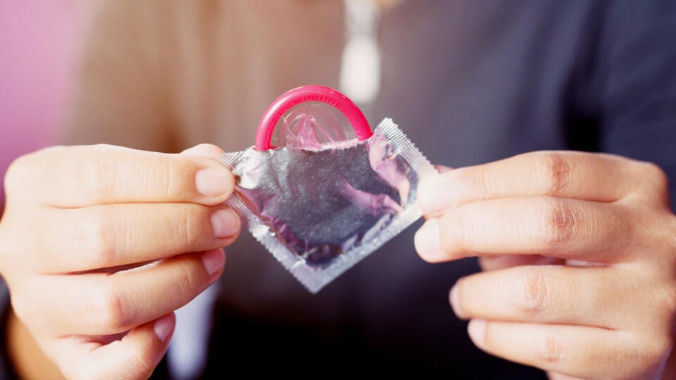 Condom,Ready,To,Use,In,Female,Hand,,Give,Condom,Safe