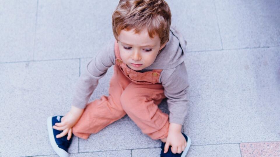 Angry,Three,Year,Old,Boy,Sitting,On,The,Floor,Refusing