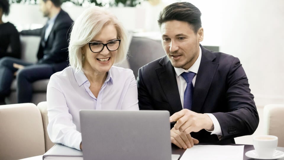 Business,Man,And,50,Years,Old,Woman,Colleagues,Looking,At