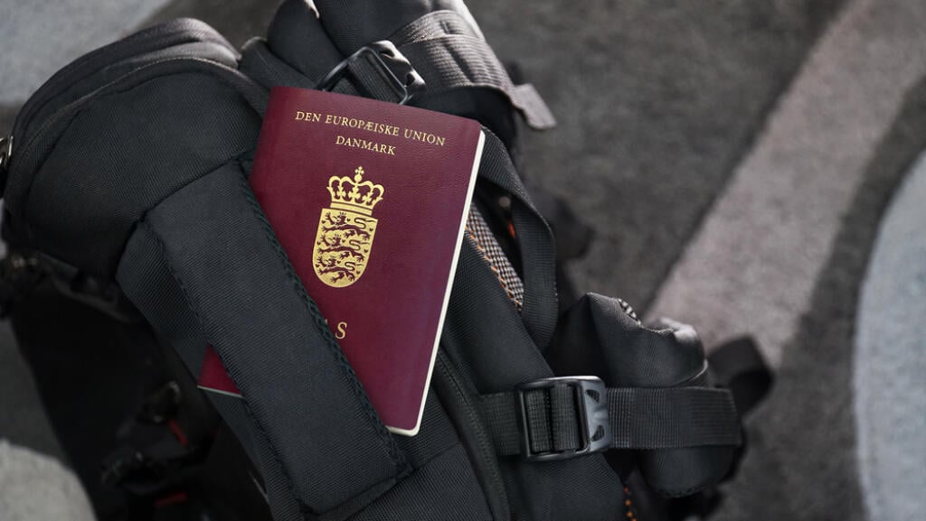 Denmark Passport on a Black Suitcase Travel Bag - Danish