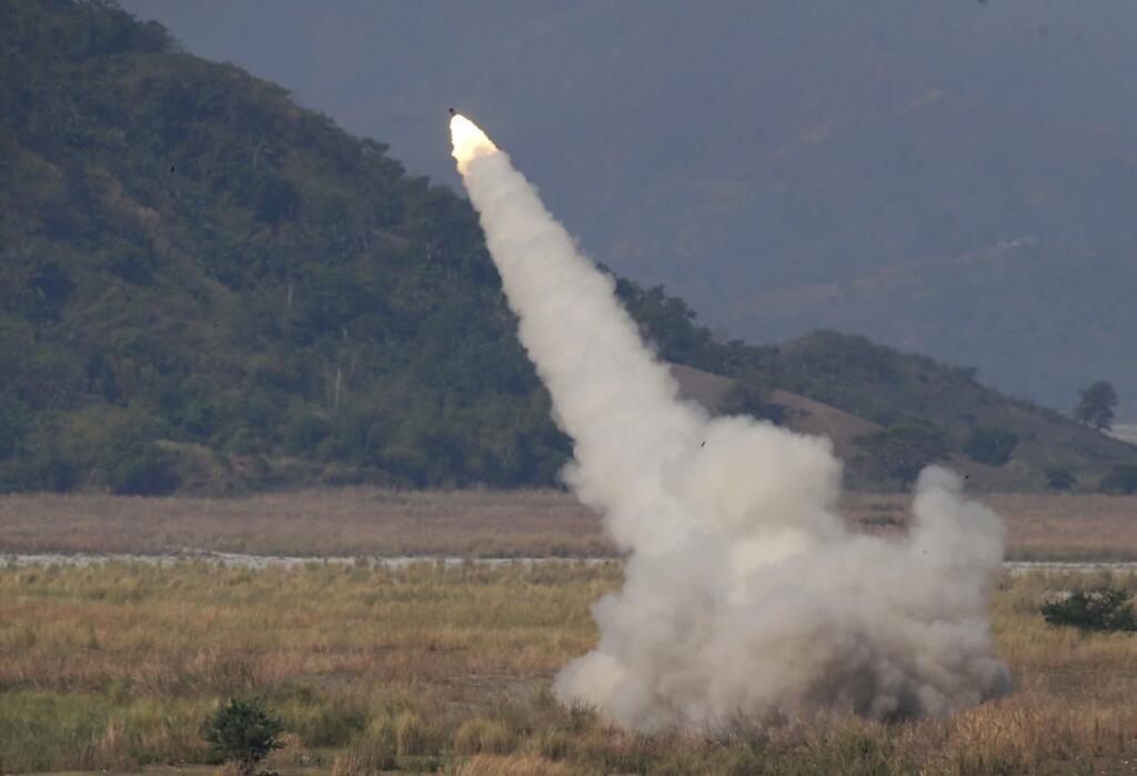 A US-made HIMARS (High Mobility Advanced Rocket System) fires at a target during the highlight of the 11-day joint US-Philippines military exercise dubbed 