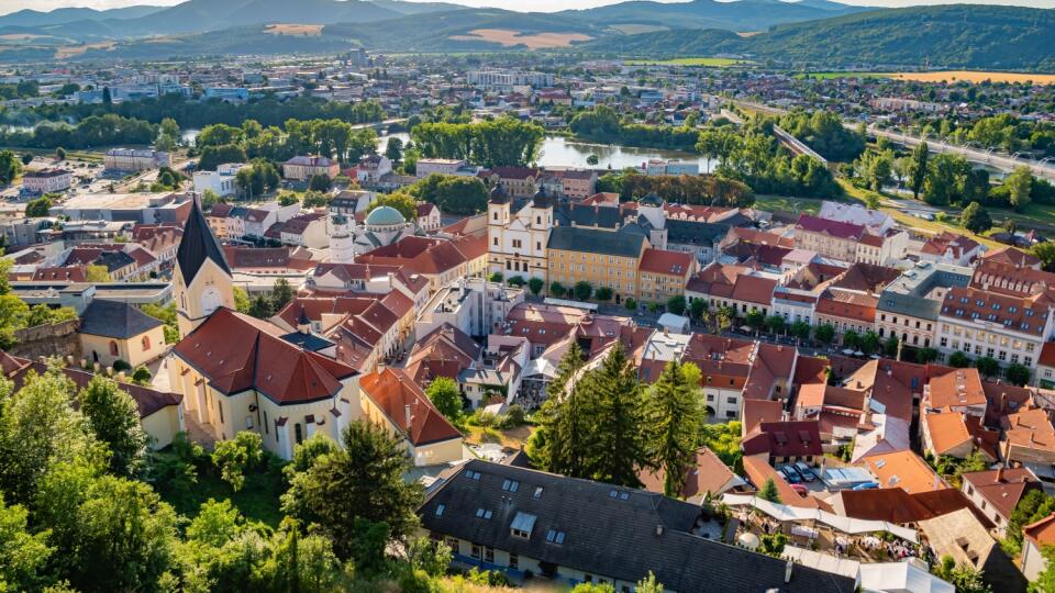TRENCIN (TRENČÍN), SLOVAKIA – JULY 15, 2022: Beautiful view of old city centre and the Vah river from the Trenčín castle (Trenčiansky hrad) on a sunny day, Trencin Region (Trenčiansky kraj)