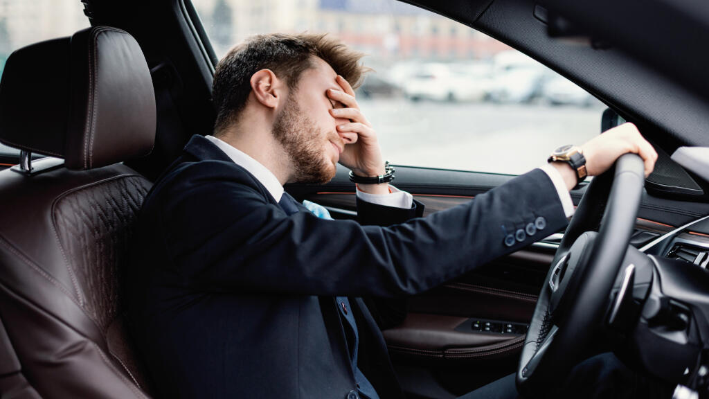 Being,Late.,Upset,And,Tired,Worker,Driving,Car,In,Urban