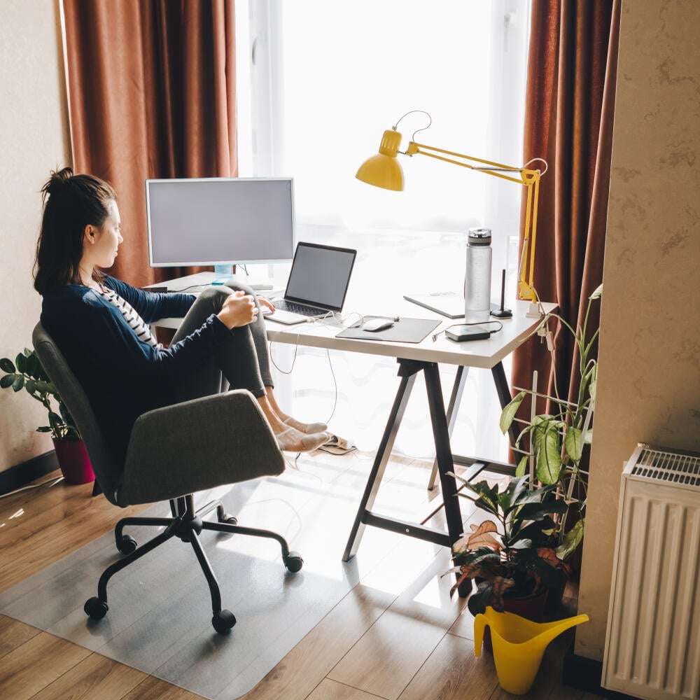 woman working at home. telework on laptop