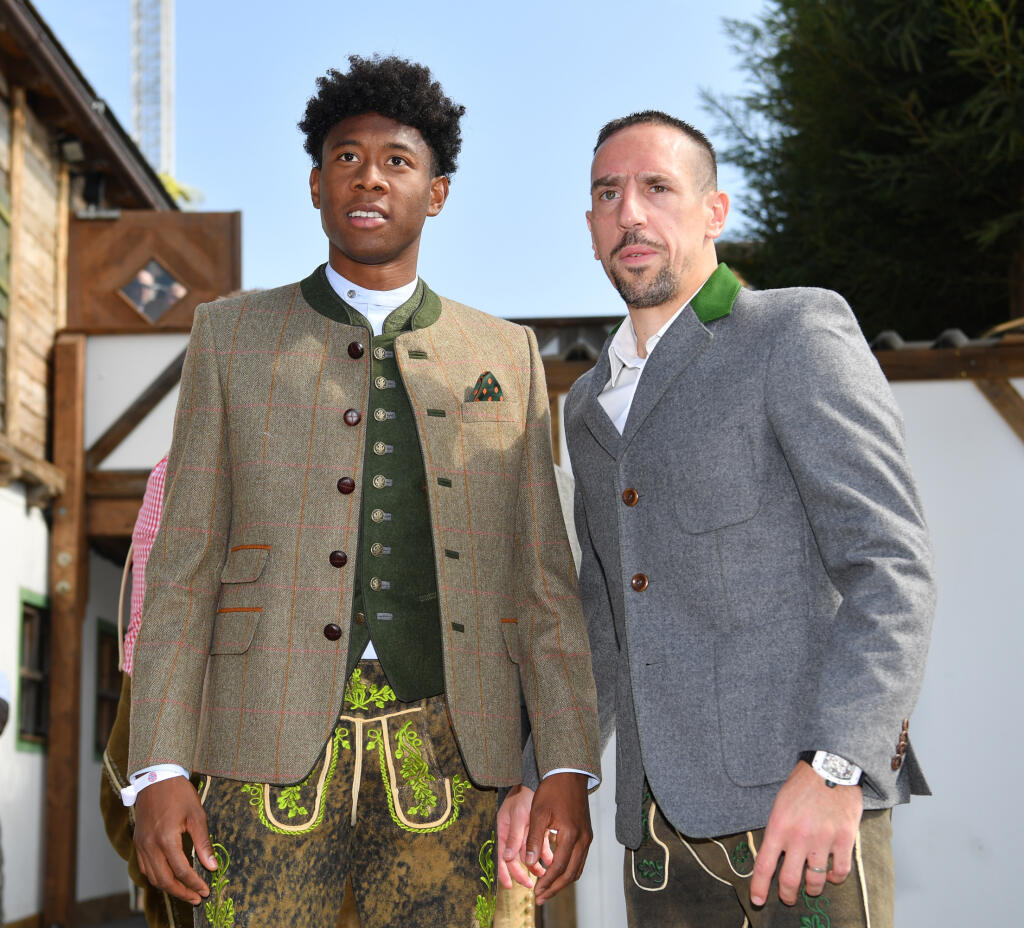 MUNICH, GERMANY - SEPTEMBER 23: Franck Ribery (r) and David Alaba of FC Bayern Muenchen attend the Oktoberfest beer festival at Kaefer Wiesnschaenke tent at Theresienwiese on September 23, 2017 in Munich, Germany. (Photo by Sebastian Widmann/Getty Images For Paulaner)