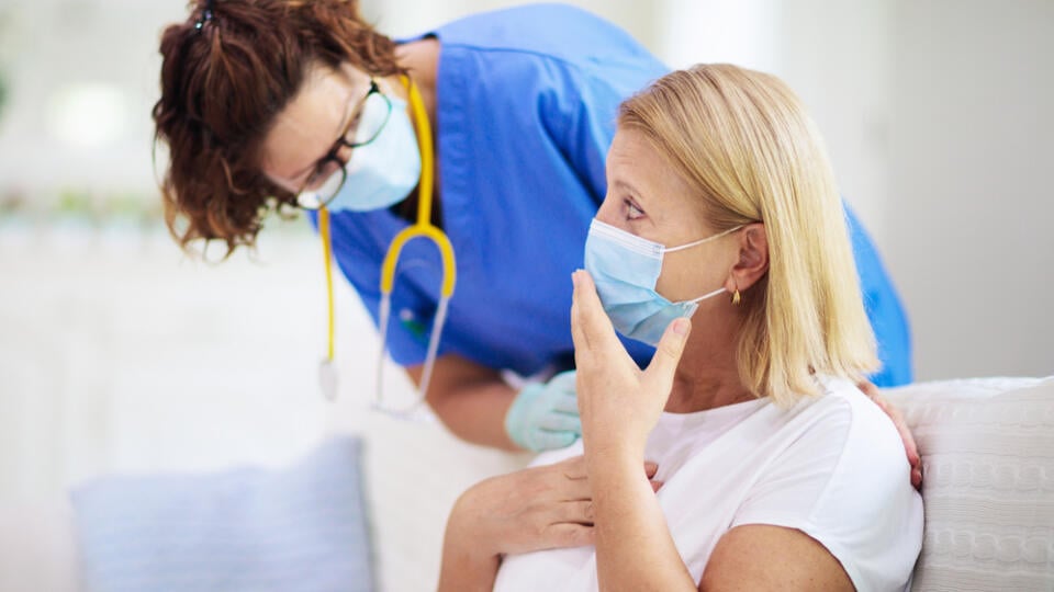 Doctor,Examining,Sick,Patient,In,Face,Mask.,Ill,Woman,In