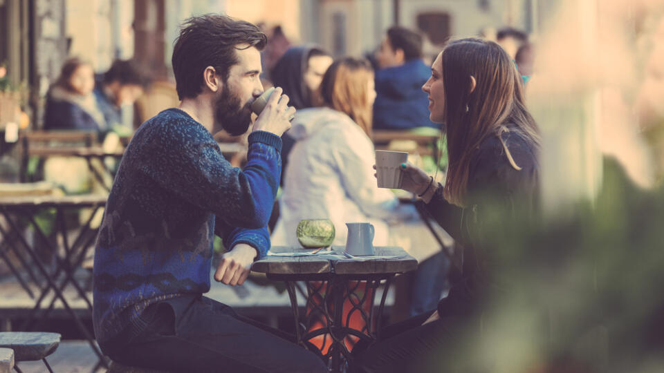 Hipster,Couple,Drinking,Coffee,In,Stockholm,Old,Town.,They're,Sitting