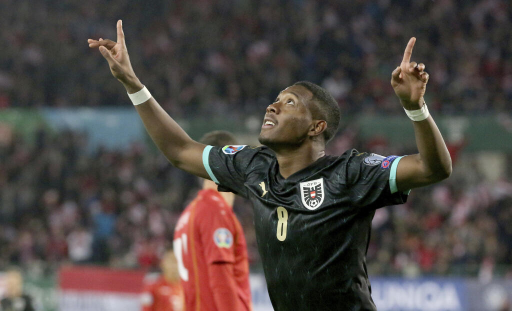 WA 68 Viedeň - Rakúsky futbalista David Alaba sa teší po strelení gólu v kvalifikačnom zápase G-skupiny EURO 2020 Rakúsko - Severné Macedónsko vo Viedni 16. novembra 2019. FOTO TASR/AP
Austria's David Alaba reacts after scoring during the Euro 2020 group G qualifying soccer match between Austria and North Macedonia at Ernst-Happel stadium in Vienna, Austria, Saturday, Nov. 16, 2019. (AP Photo/Ronald Zak)