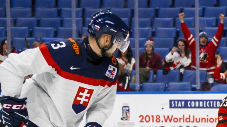 Canada's Sam Steel, right, celebrates his goal against Slovakia goalie David Hrenak (1) during the first period of IIHF World Junior Championship preliminary round hockey game action in Buffalo, N.Y., Wednesday, Dec. 27, 2017. (Mark Blinch/The Canadian Press via AP)