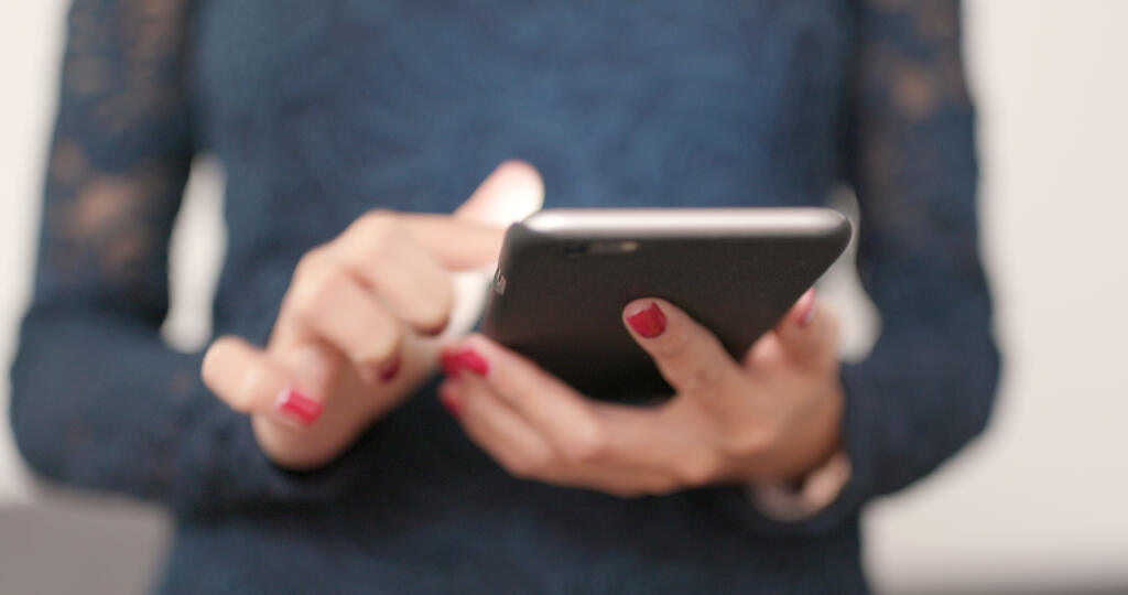 Close up of woman use of mobile phone