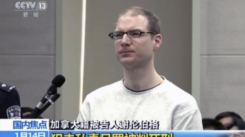 In this image taken from a video footage run by China's CCTV, Canadian Robert Lloyd Schellenberg attends his retrial at the Dalian Intermediate People's Court in Dalian, northeastern China's Liaoning province on Monday, Jan. 14, 2019. A Chinese court sentenced the Canadian man to death Monday in a sudden retrial in a drug smuggling case that is likely to escalate tensions between the countries over the arrest of a top Chinese technology executive. (CCTV via AP)