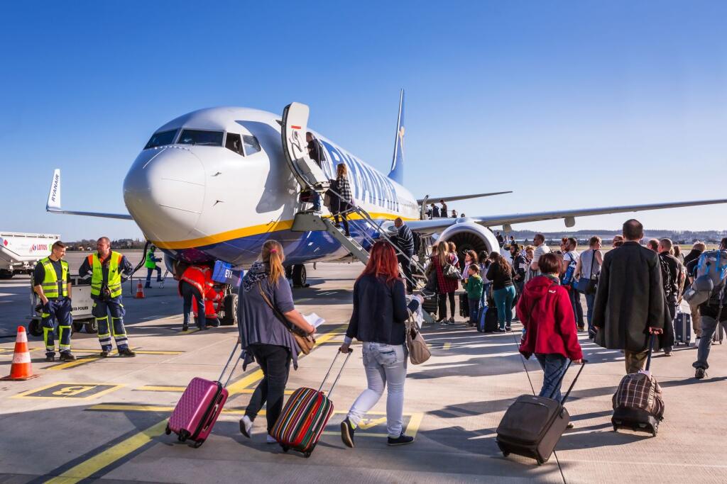 People boarding to Ryanair plane on Lech Walesa Airport in Gdansk