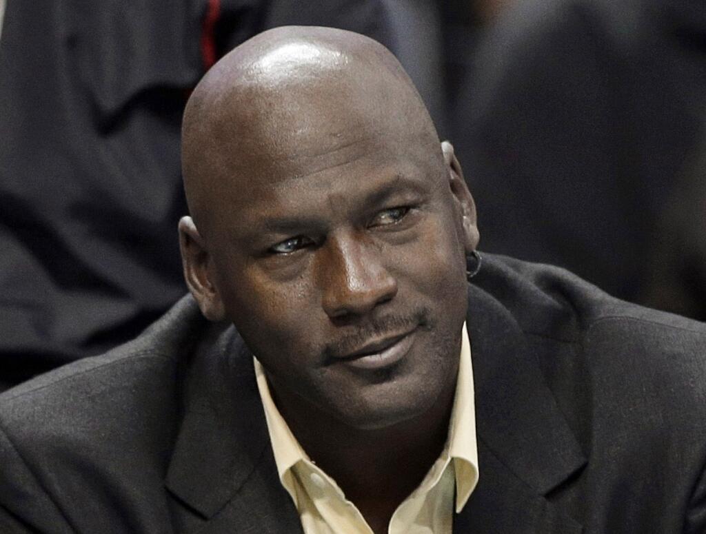 Michael Jordan s druhou manželkou a matkou Marcusa, Juanitou Vanoy. Zdá sa, že majú byť prečo pyšní na svoje deti.