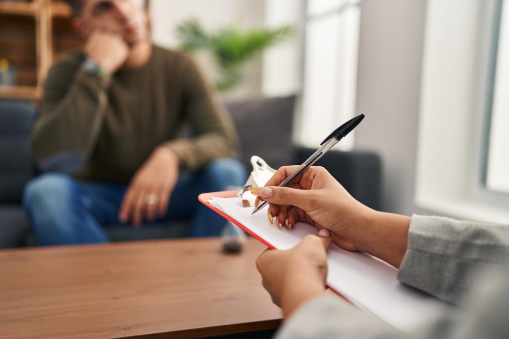 Man,And,Woman,Having,Psychology,Session,At,Clinic