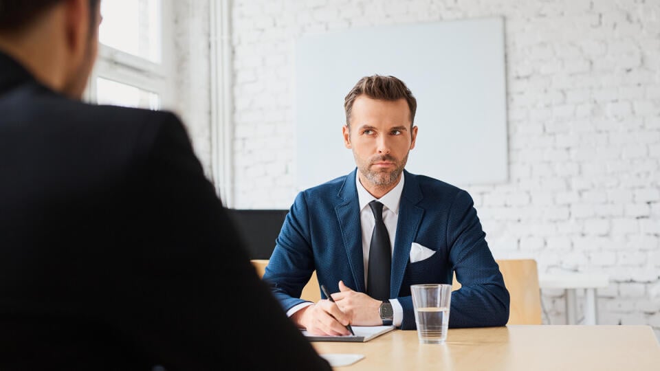 Job interview - businessman listen to candidate answers