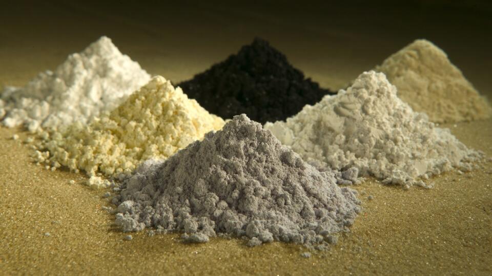 In this undated photo released by the U.S. Department of Agriculture are rare-earth oxides, clockwise from top center: praseodymium, cerium, lanthanum, neodymium, samarium, and gadolinium. Across the West, early miners digging for gold, silver and copper had no idea that one day something even more valuable would be hidden in the piles of dirt and rocks they tossed aside. Now there’s a rush in the U.S. to find key components of cellphones, televisions, weapons systems, wind turbines, MRI machine