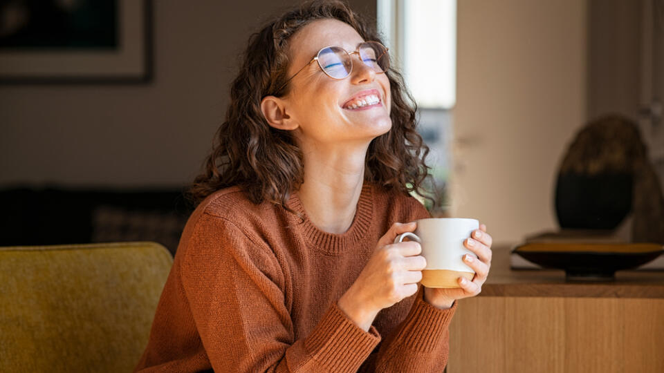 Portrait,Of,Joyful,Young,Woman,Enjoying,A,Cup,Of,Coffee