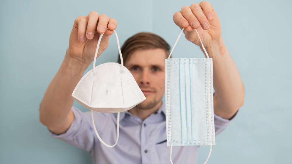 Man,Holding,Ffp2,Respirator,And,Surgical,Face,Masks.,Time,To