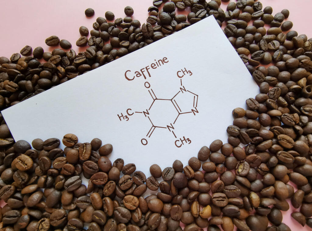 Structural,Chemical,Formula,Of,Caffeine,Molecule,With,Roasted,Coffee,Beans.