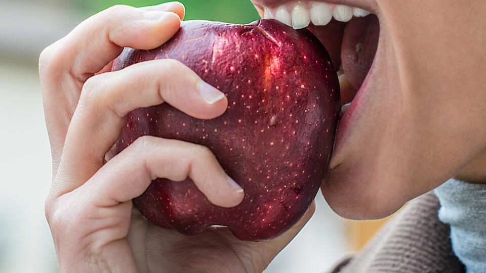 A,Young,Attractive,Girl,Eats,An,Apple