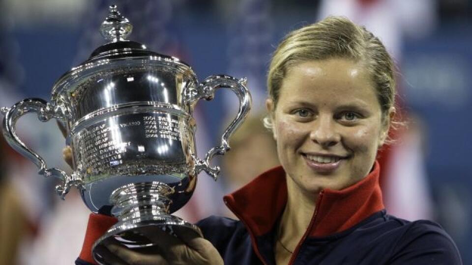 Kim Clijsters, of Belgium, holds the trophy after winning the women's championship over Caroline Wozniacki, of Denmark, at the U.S. Open tennis tournament in New York, Sunday, Sept. 13, 2009. (AP Photo/Charles Krupa)