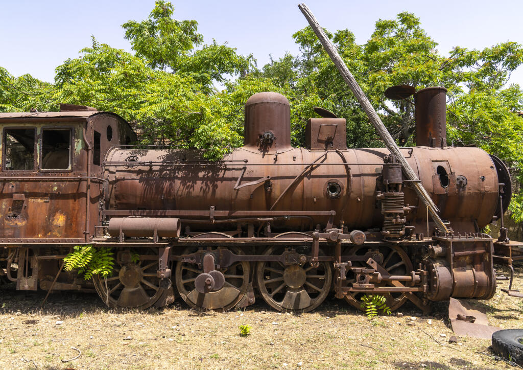 Old locomotive from BeirutDamascus line covered by plants, Beqaa Governorate, Rayak, Lebanon