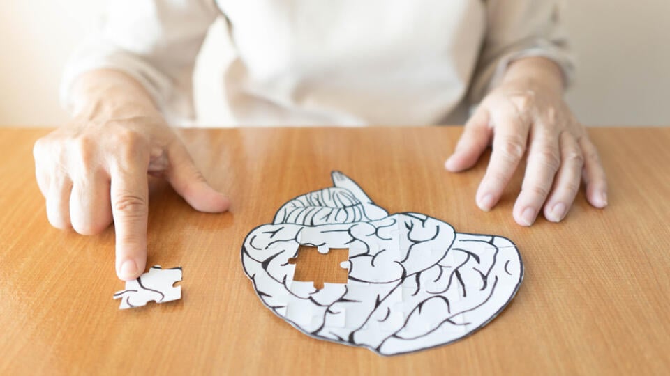 Elderly,Woman,Hands,Putting,Missing,White,Jigsaw,Puzzle,Piece,Down