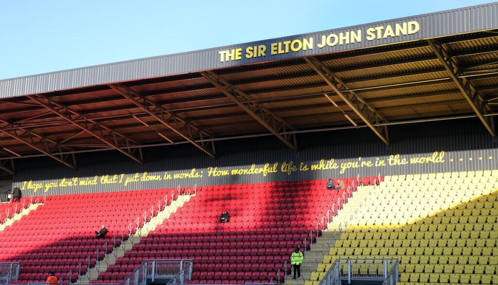 Po Eltonovi Johnovi je pomenová jedna z tribún na Vicarage Road, ktorý je domovským stánkom Watfordu.
