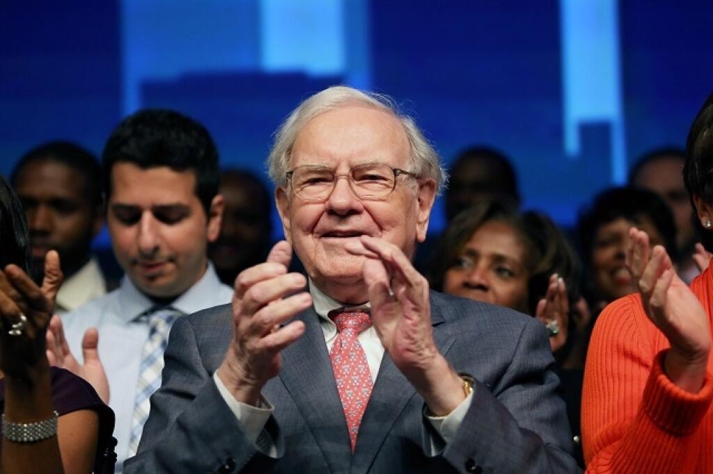 Warren Buffett claps during the Goldman Sachs celebration ceremony of the first graduating class of the 10,000 Small Businesses at Wayne State University on Thursday, Sept. 18, 2014, in Detroit. The investment banking firm committed $20 million to Detroit and southeast Michigan to help small businesses create jobs and economic growth by providing entrepreneurs with a practical business education, access to capital and business support services. (AP Photo/Detroit Free Press, Jessica J. Trevino)  