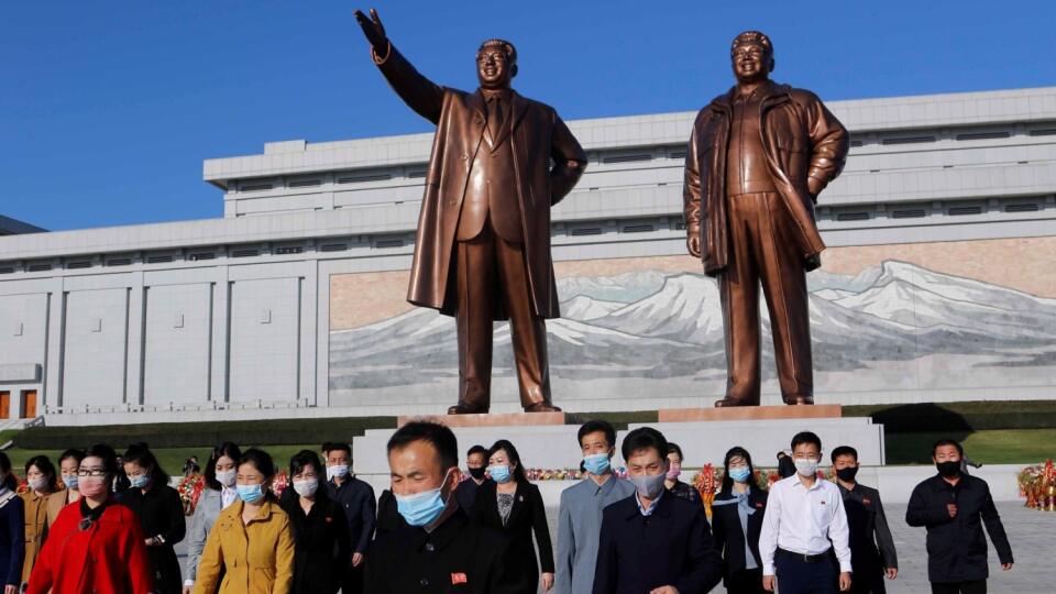 People visit the Mansu Hill to lay flowers to the bronze statues of former North Korean leaders Kim Il Sung and Kim Jong Il in Pyongyang, North Korea, Saturday, Oct. 10, 2020, on the occasion of the 75th founding anniversary of the country's Workers' Party.
