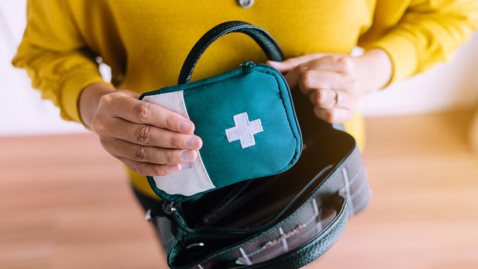 Hands,Woman,Holding,A,Medicine,First,Aid,Kit,Bag,Putting