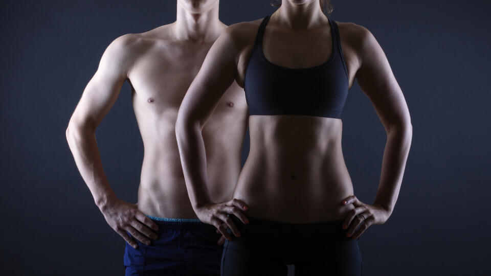 Man,And,Woman's,Torso,Isolated,On,A,Black,Background