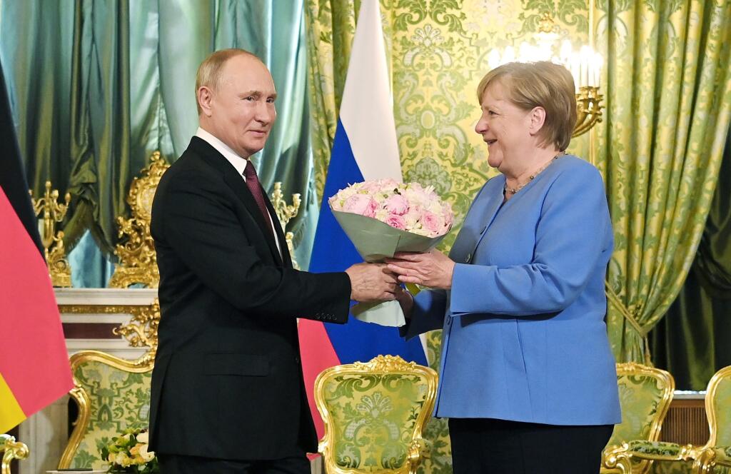 Ruský prezident Vladimir Putin a kancelárka Angela Merkelová počas stretnutia v Moskve 20. augusta 2021