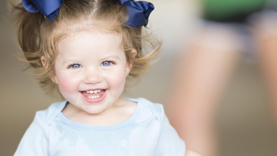 Cute toddler girl laughing and smiling