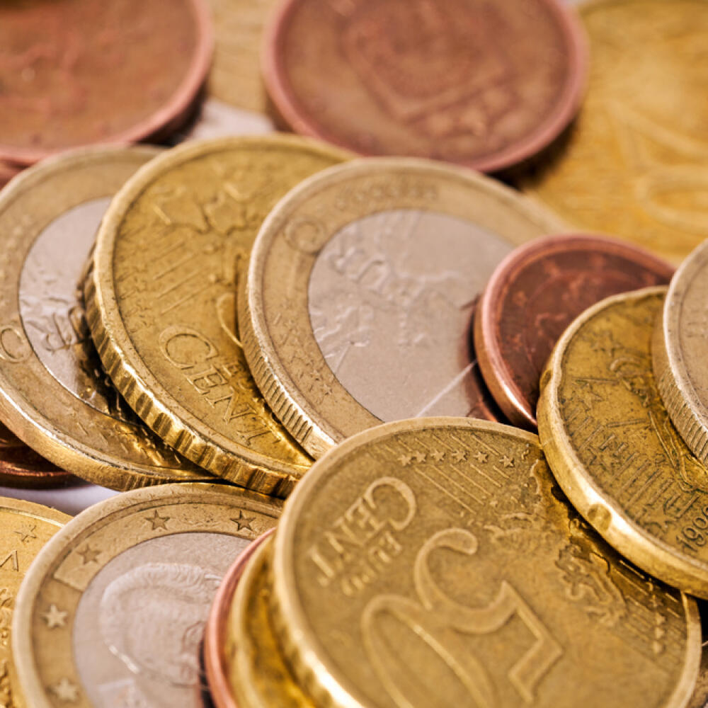 Money,Laundering,On,Clothesline,On,Light,Background.,Handful,Of,Coins.