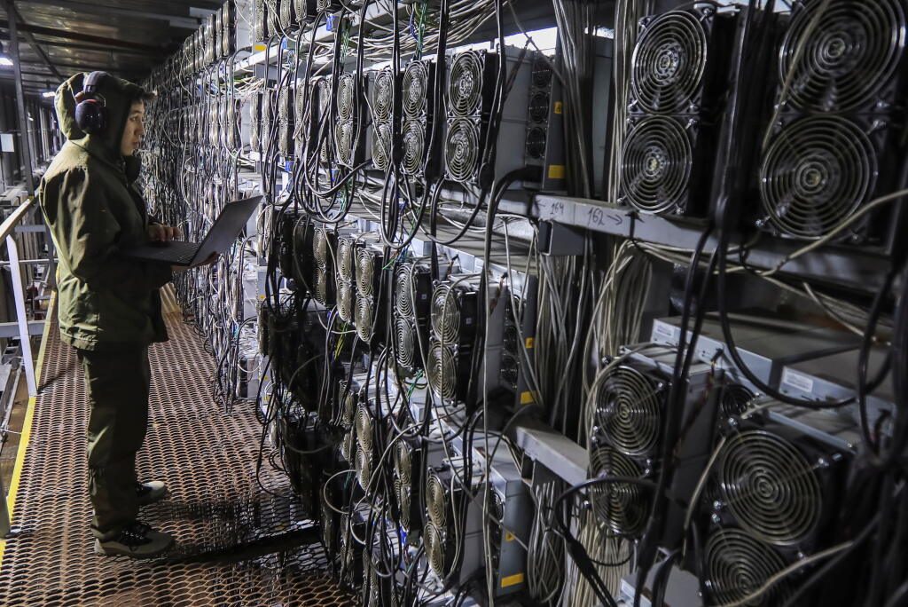 A maintenance specialist works inside the data center of the BTC KZ crypto mining company outside Ekibastuz