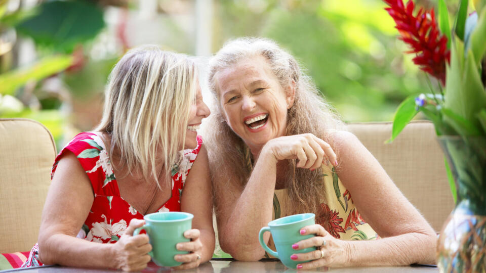 Pair,Of,Cute,Middle,Aged,Female,Friends,Laughing