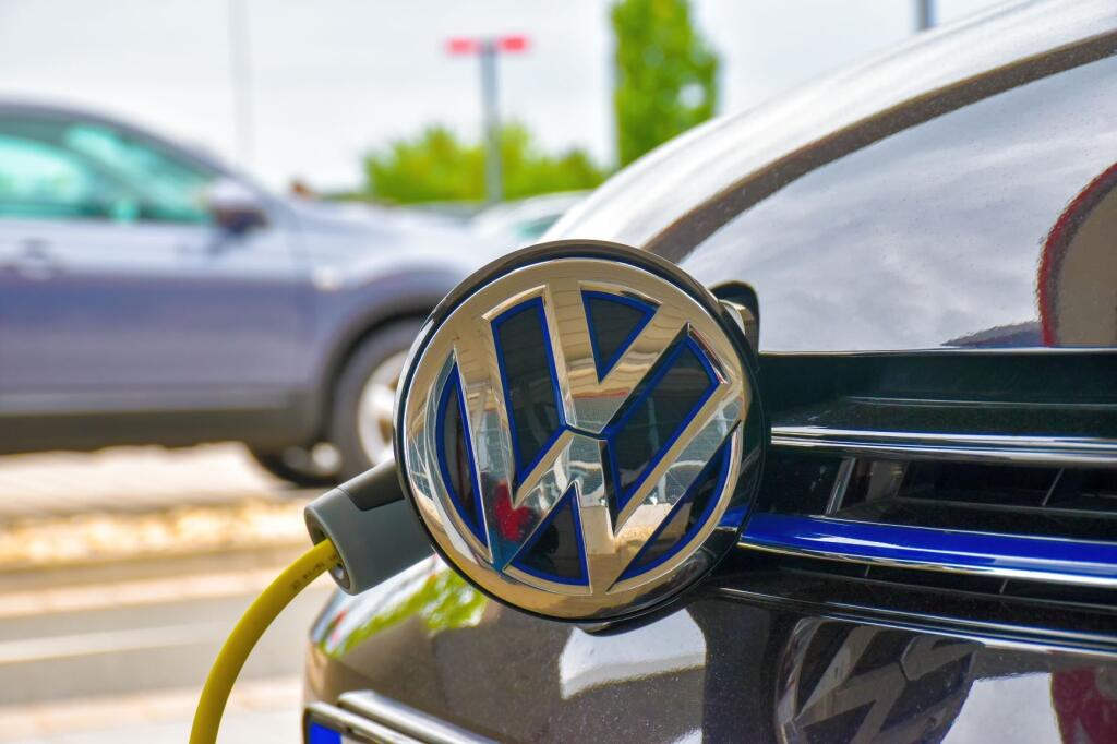 A Volkswagen Golf GTE is charged at a charging station